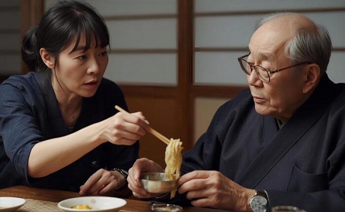 義父に食事の世話をする女性